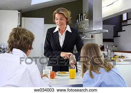 Stock Image - boy, businesspeople, brother, breakfast, at-home. Fotosearch