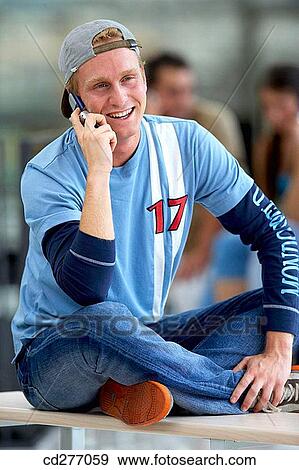 Stock Photo - boy, cap, calling, adolescence. Fotosearch