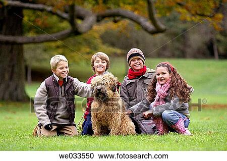 Stock Image - boy, child, brother, animal. Fotosearch