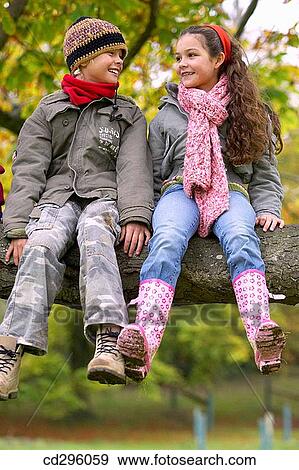 Stock Photo - boy, child, brother, branch, amusement. Fotosearch