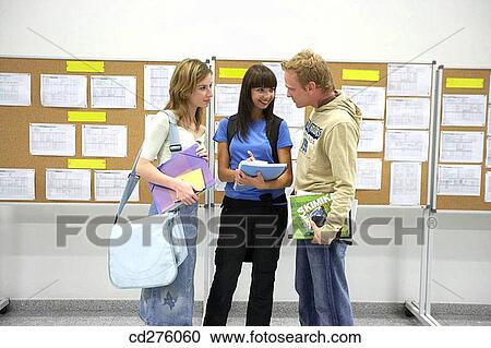 Stock Image - boy, college, chat, Bulletin board, adolescence. Fotosearch