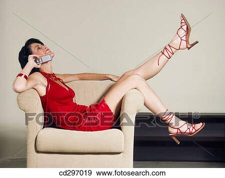 brunette, cell phone, carefree, armchair View Large Photo Image Stock Photo - brunette, cell phone, carefree, armchair. Fotosearch