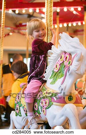 Stock Photography - Burnaby Heritage Village Carousel, 4 year old Caucasian girl. Fotosearch