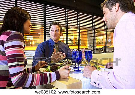 Stock Image - business, businesspeople, businessman, Business lunch, 30's. Fotosearch