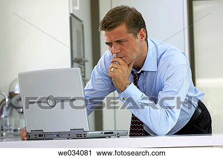 Stock Image - business, casual, businesspeople, businessman, at-home. Fotosearch