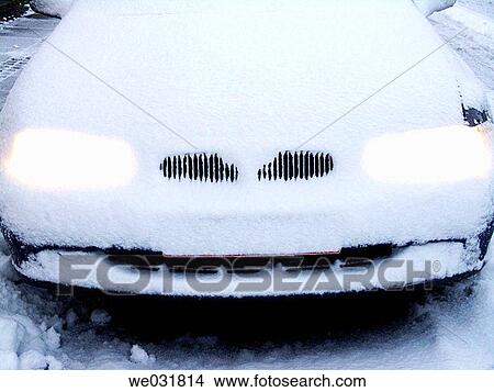 Picture - Car completely covered in snow after storm. Fotosearch