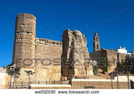 Stock Image - Carmona town gate tower and church of Santa Mar? a de la Mota (16th century), Marchena. Sevilla province, Andalusia, Spain. Fotosearch