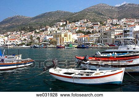 Stock Photo - Colorful fishing boats and pleasure craft in the harbor at Samos or Vathi village on the island of Samos, Greece.. Fotosearch