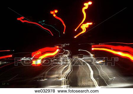 Converging tail lights at night View Large Photo Image Stock Photo - Converging tail lights at night. Fotosearch