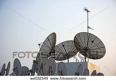 Crowded roof top full of sateliite dishes. Dubai, UAE View Large Photo Image Stock Photo - Crowded roof top full of sateliite dishes. Dubai, UAE. Fotosearch