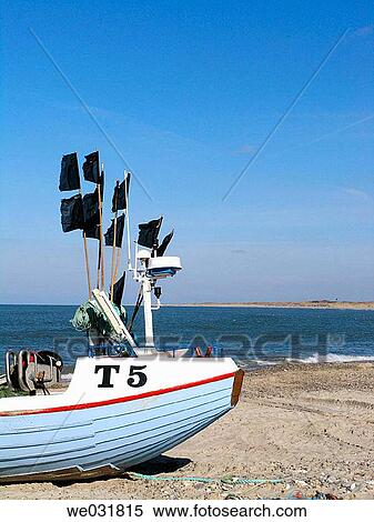 Denmark, fishing boat drawn up on the beach at Vorupure in western Jutland View Large Photo Image Stock Photography - Denmark, fishing boat drawn up on the beach at Vorupure in western Jutland. Fotosearch
