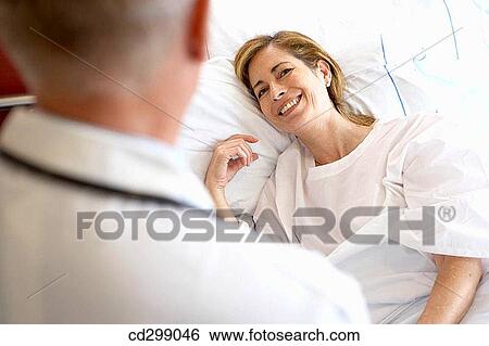 Doctor and patient in hospitalization View Large Photo Image Stock Photograph - Doctor and patient in hospitalization. Fotosearch