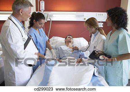 Doctor, nurses and patient in hospitalization View Large Photo Image Stock Image - Doctor, nurses and patient in hospitalization. Fotosearch