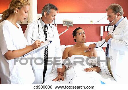 Doctors and patient in hospitalization View Large Photo Image Stock Photograph - Doctors and patient in hospitalization. Fotosearch