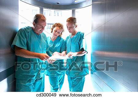 Doctors in lift View Large Photo Image Stock Photo - Doctors in lift. Fotosearch