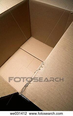 Empty cardboard box, focus on detail of torn edge in foreground View Large Photo Image Stock Image - Empty cardboard box, focus on detail of torn edge in foreground. Fotosearch