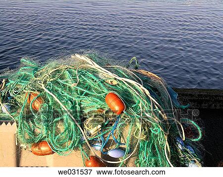 Fishing nets on a box in the habour, Denmark View Large Photo Image Stock Photo - Fishing nets on a box in the habour, Denmark. Fotosearch