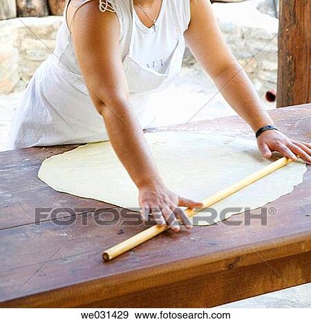 Stock Photo - Fixing paste in Enagron traditional house, Axos village. Crete, Greece. Fotosearch