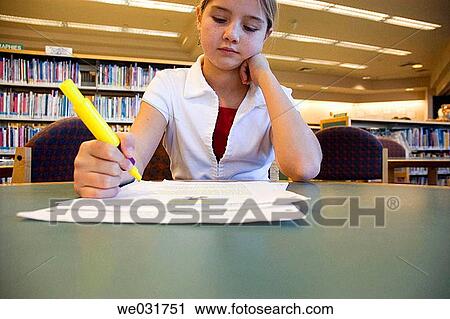Girl studying in library View Large Photo Image Stock Image - Girl studying in library. Fotosearch