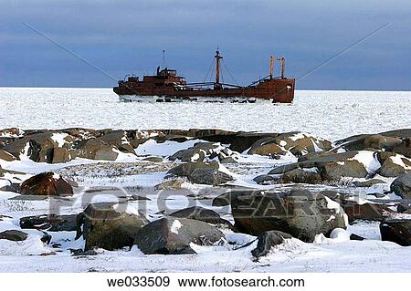 he wreck of the Ithica in ice on Hudson Bay just outside of Churchill, Manitoba, Canada View Large Photo Image Stock Photo - he wreck of the Ithica in ice on Hudson Bay just outside of Churchill, Manitoba, Canada. Fotosearch