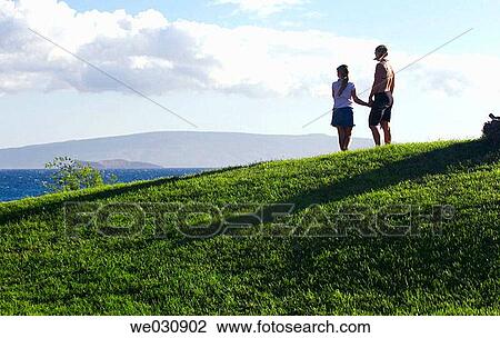 Mother and daughter looking at ocean View Large Photo Image Stock Image - Mother and daughter looking at ocean. Fotosearch