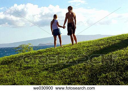 Mother and daughter overlooking ocean View Large Photo Image Stock Image - Mother and daughter overlooking ocean. Fotosearch