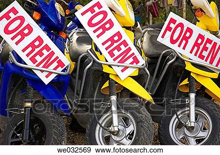 Motor scooters for rent in holiday resort View Large Photo Image Stock Photo - Motor scooters for rent in holiday resort. Fotosearch