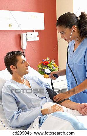 Stock Photography - Nurse and patient in hospitalization. Fotosearch