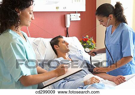 Nurses and patient in hospitalization View Large Photo Image Stock Photo - Nurses and patient in hospitalization. Fotosearch