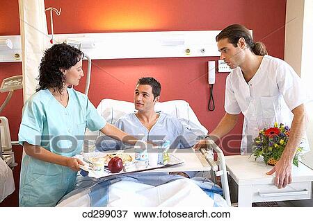 Nurses and patient in hospitalization View Large Photo Image Stock Photo - Nurses and patient in hospitalization. Fotosearch