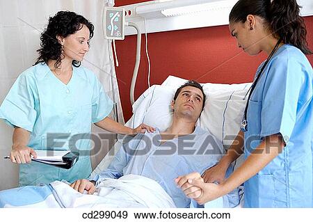 Nurses and patient in hospitalization View Large Photo Image Stock Photo - Nurses and patient in hospitalization. Fotosearch