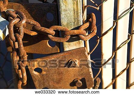 Stock Image - Old padlock on gate.. Fotosearch