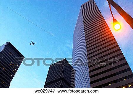 Plane flying above the Seattle skyline - Washington State, USA View Large Photo Image Stock Photo - Plane flying above the Seattle skyline - Washington State, USA. Fotosearch