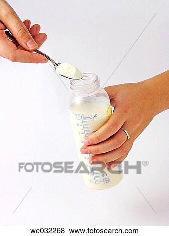 Preparing feeding bottle View Large Photo Image Stock Photo - Preparing feeding bottle. Fotosearch