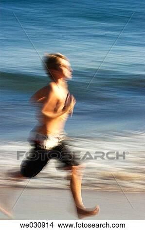 Running beach boy View Large Photo Image Picture - Running beach boy. Fotosearch