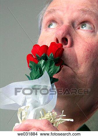 Smelling the Roses View Large Photo Image Picture - Smelling the Roses. Fotosearch