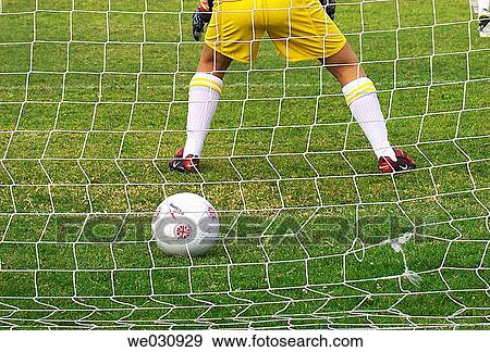Stock Photo - Soccer ball in goal. Fotosearch