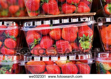Strawberries in plastic boxes for sale View Large Photo Image Stock Image - Strawberries in plastic boxes for sale. Fotosearch