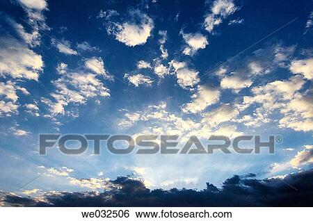 Sun rays on clouds View Large Photo Image Stock Photograph - Sun rays on clouds. Fotosearch