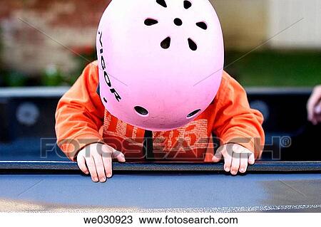 Toddler wearing bike helmet View Large Photo Image Stock Image - Toddler wearing bike helmet. Fotosearch
