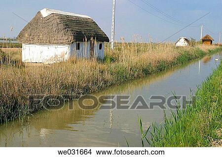 Traditional hut in La Tancada. Delta del Ebre Natural Park. Tarragona Province. Catalunya. Spain View Large Photo Image Picture - Traditional hut in La Tancada. Delta del Ebre Natural Park. Tarragona Province. Catalunya. Spain. Fotosearch