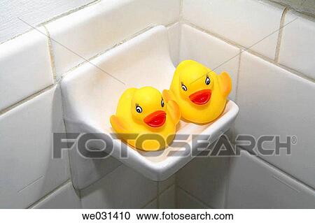 Two small yellow rubber ducks sit on soap dish in bathroom View Large Photo Image Stock Image - Two small yellow rubber ducks sit on soap dish in bathroom. Fotosearch