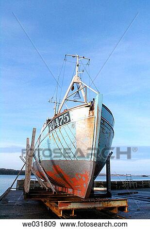 Stock Photo - Typical Danish fishing vessel in the shipyard for repair. Fotosearch
