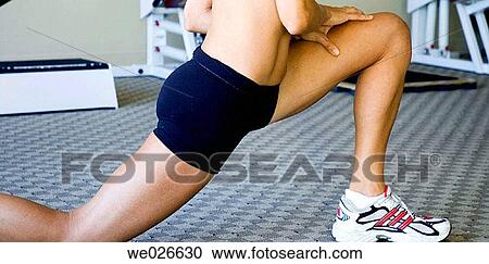 Stock Image - Woman stretching. Fotosearch