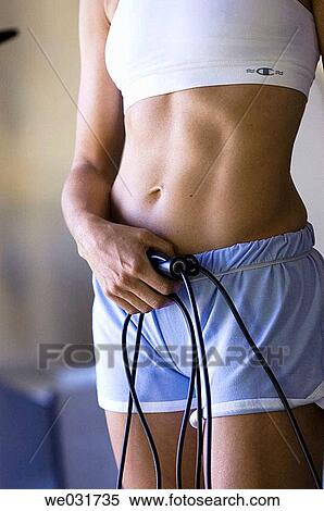 Woman with jump ropes in gym View Large Photo Image Stock Photography - Woman with jump ropes in gym. Fotosearch