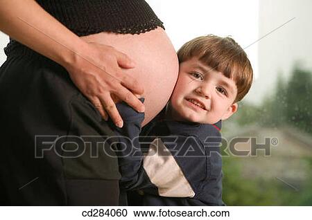 Young boy and pregnant mother View Large Photo Image Stock Image - Young boy and pregnant mother. Fotosearch