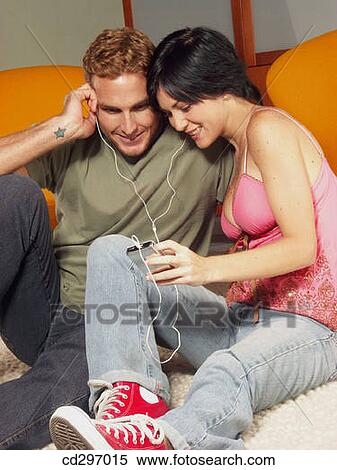 young couple listening music View Large Photo Image Stock Photography - young couple listening music. Fotosearch