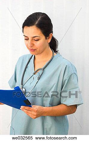 Young female medical professional with patient file View Large Photo Image Stock Photography - Young female medical professional with patient file. Fotosearch