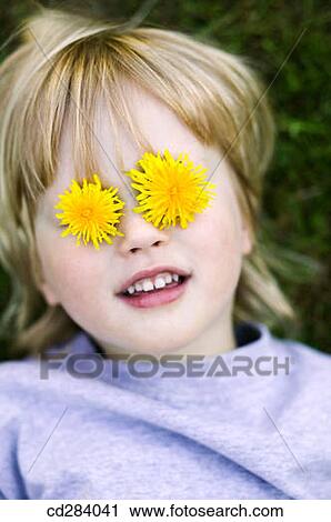 Young girl (3 yrs) with dandelions over eyes View Large Photo Image Stock Image - Young girl (3 yrs) with dandelions over eyes. Fotosearch