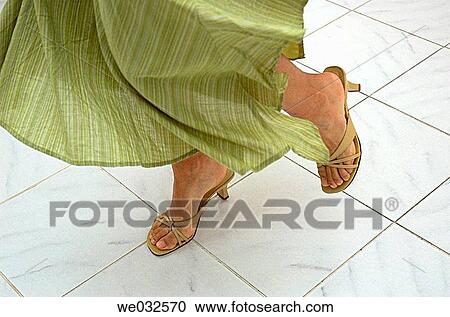 Young woman's legs in a dance motion on tile floor View Large Photo Image Stock Image - Young woman's legs in a dance motion on tile floor. Fotosearch